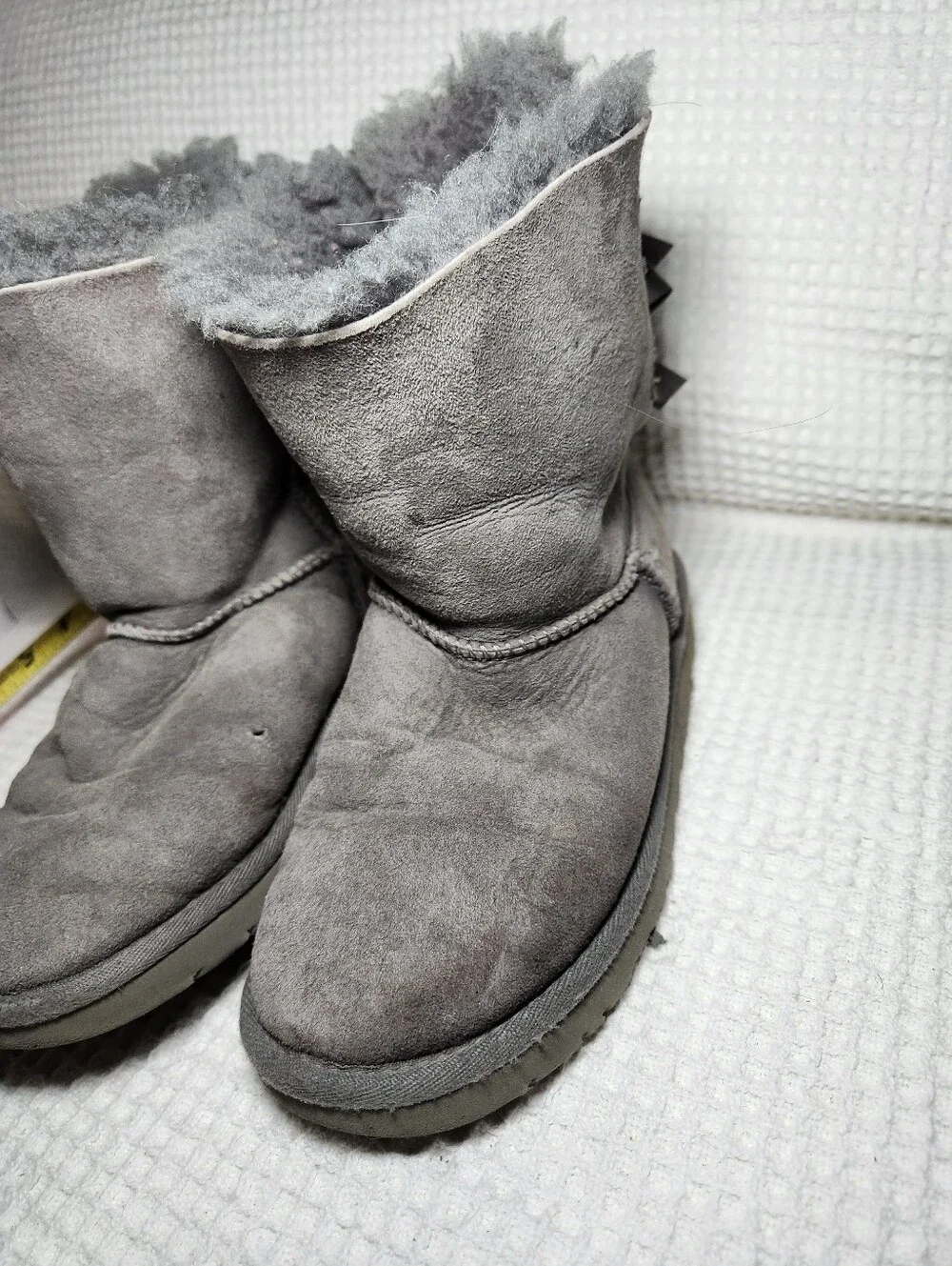 UGG Gray Bow Back Shearling Boots Flawed